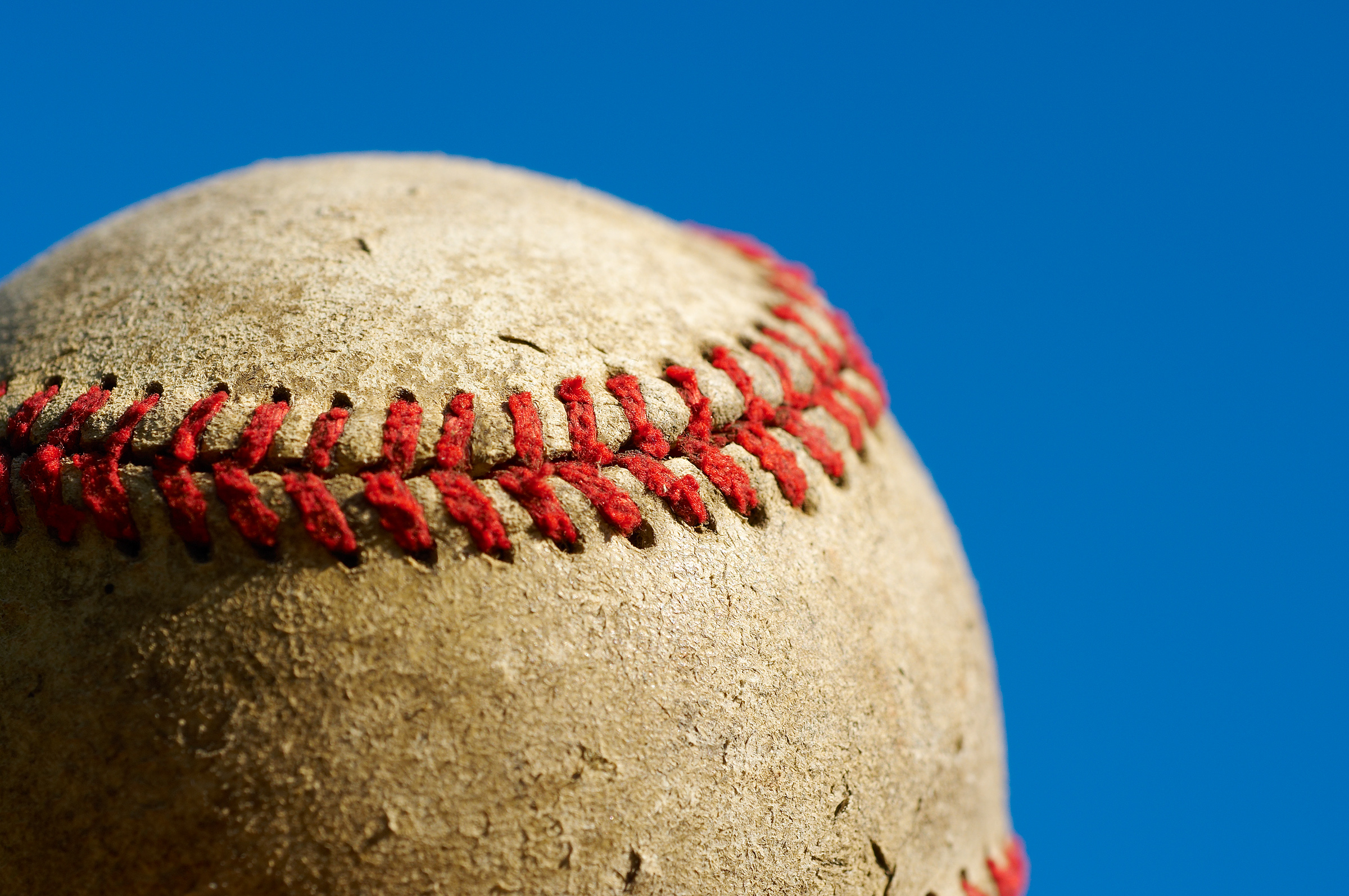 dirty baseball against clean sky 1170 KPUGAM